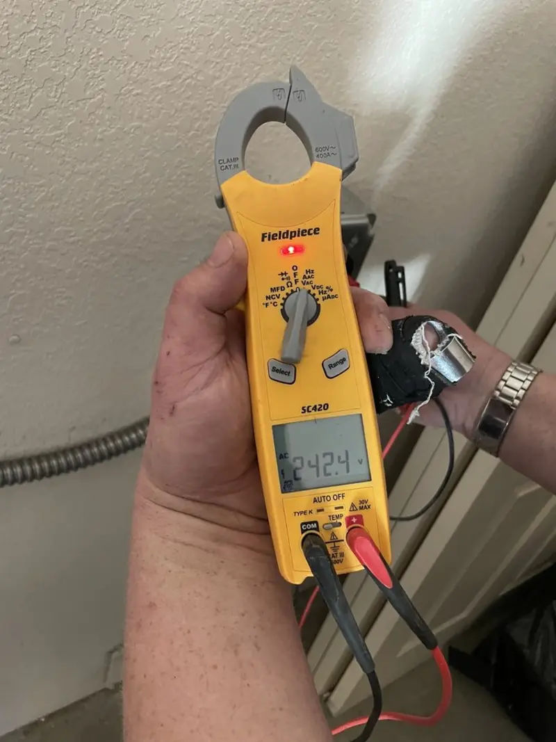 Voltage testing with clamp meter during Electrical Installation Services in Millis